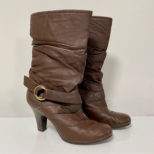 Brown slouchy faux leather slip on high heeled boots